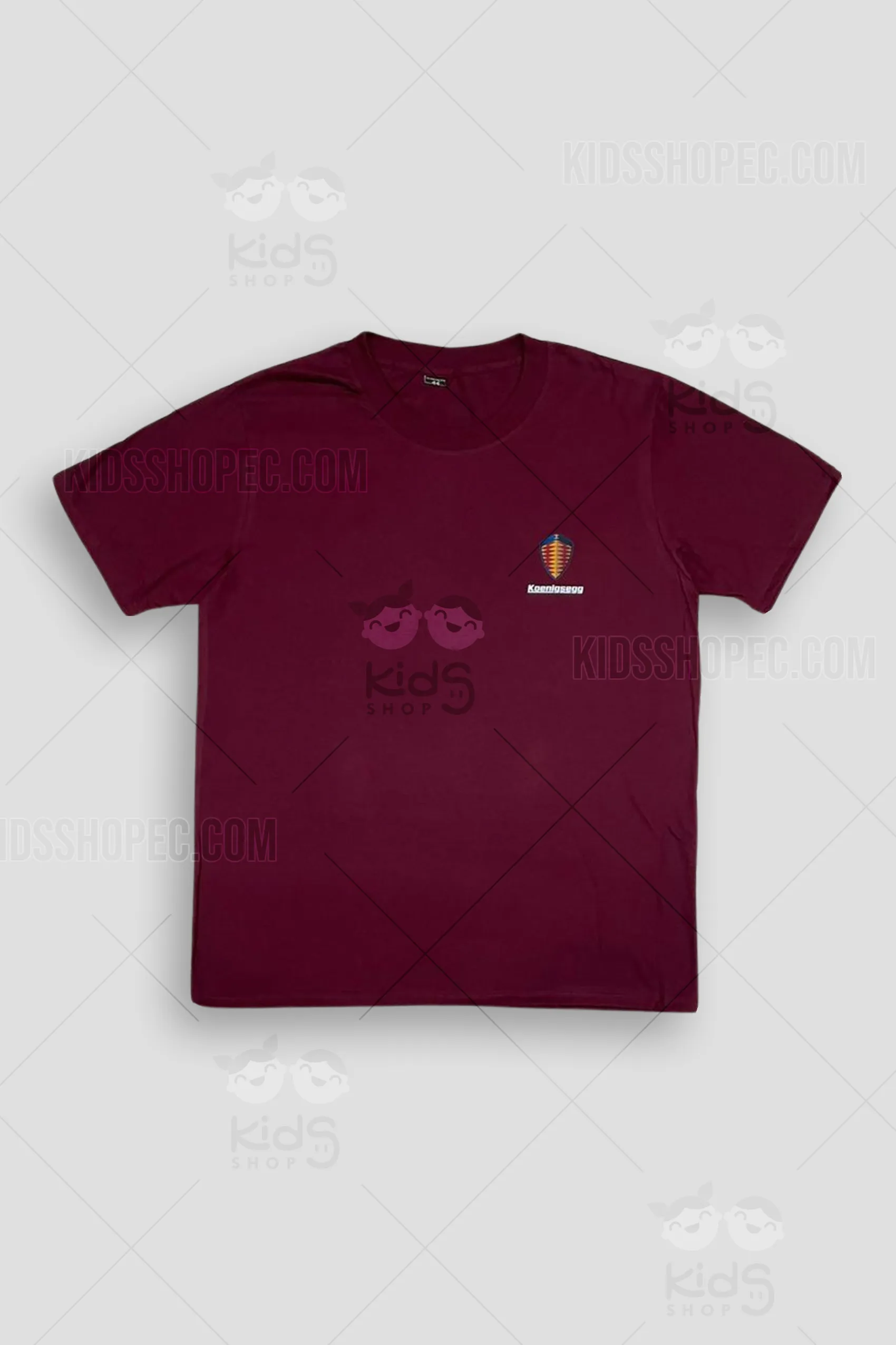 Camiseta de algodón premium gris carbón para niño con manga corta. Presenta un gran diseño de transferencia DTF en el pecho que muestra un auto clásico modificado 'JESKO' con texto 'Custom Built' y logos 'Lowrider Los Angeles'. Confección artesanal por Kids Shop EC en Ecuador.