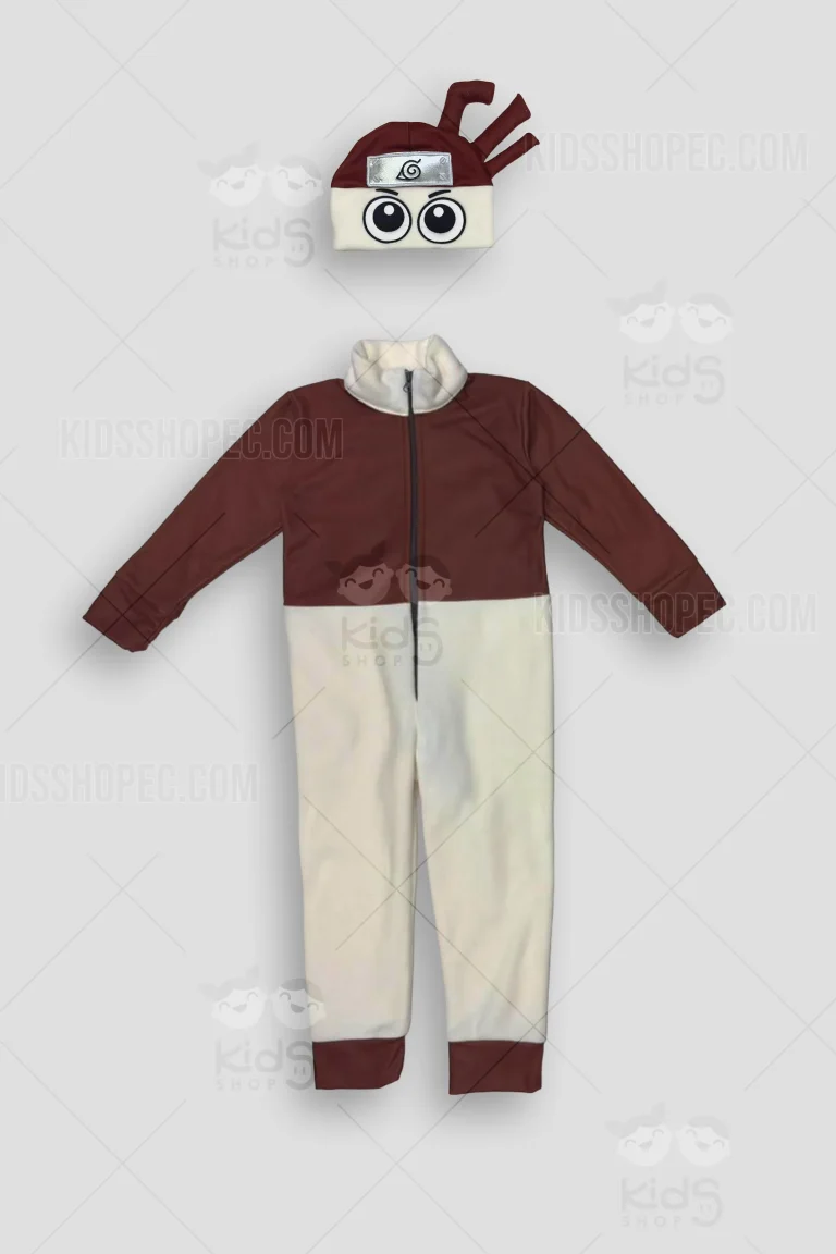 Fotografías de un disfraz infantil tipo enterizo bicolor, con la parte superior en color café y la inferior en color crema, equipado con cierre frontal oscuro. Se muestra la prenda base junto a un gorro intercambiable estilo ninja que incluye una banda frontal plateada con un símbolo en espiral, grandes ojos bordados y tres detalles tubulares en relieve en la parte superior. Las prendas están fotografiadas sobre un fondo gris claro con marcas de agua de Kids Shop EC.